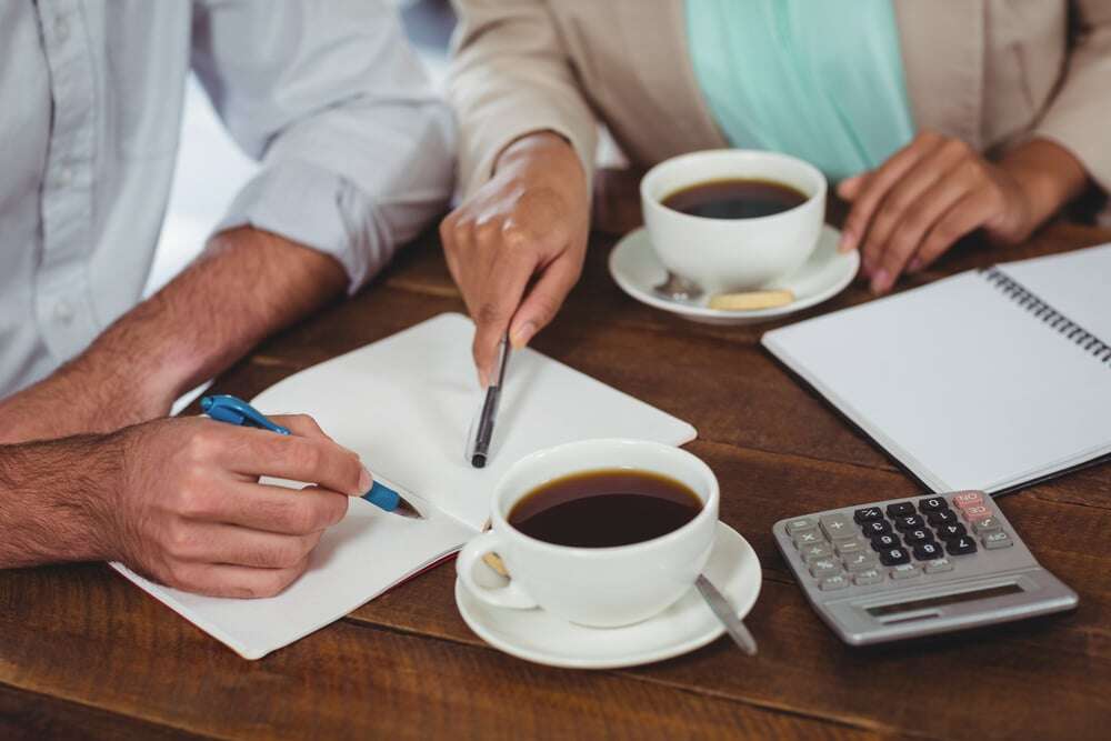 Man and woman meeting over coffee in restaurant